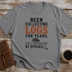 Been Collecting Logs For Years Still Distracted By Specks - T-Shirt