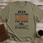 Been Collecting Logs For Years Still Distracted By Specks - T-Shirt